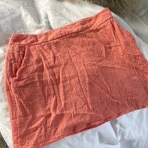 Coral pink mini skirt